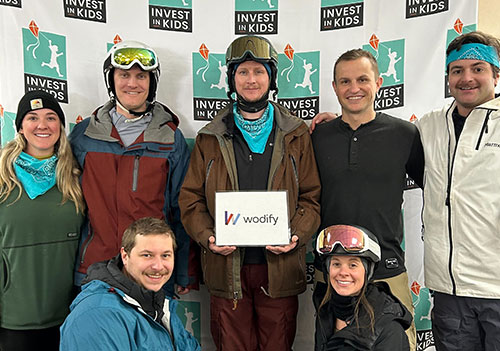 Wodify employees volunteering at Invest in Kids ski event